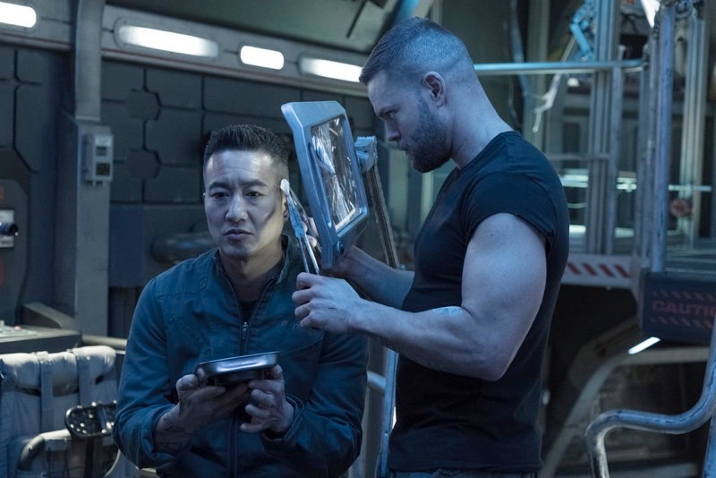 Prax and Amos, in a scene that includes a well-timed Frankenstein reference.